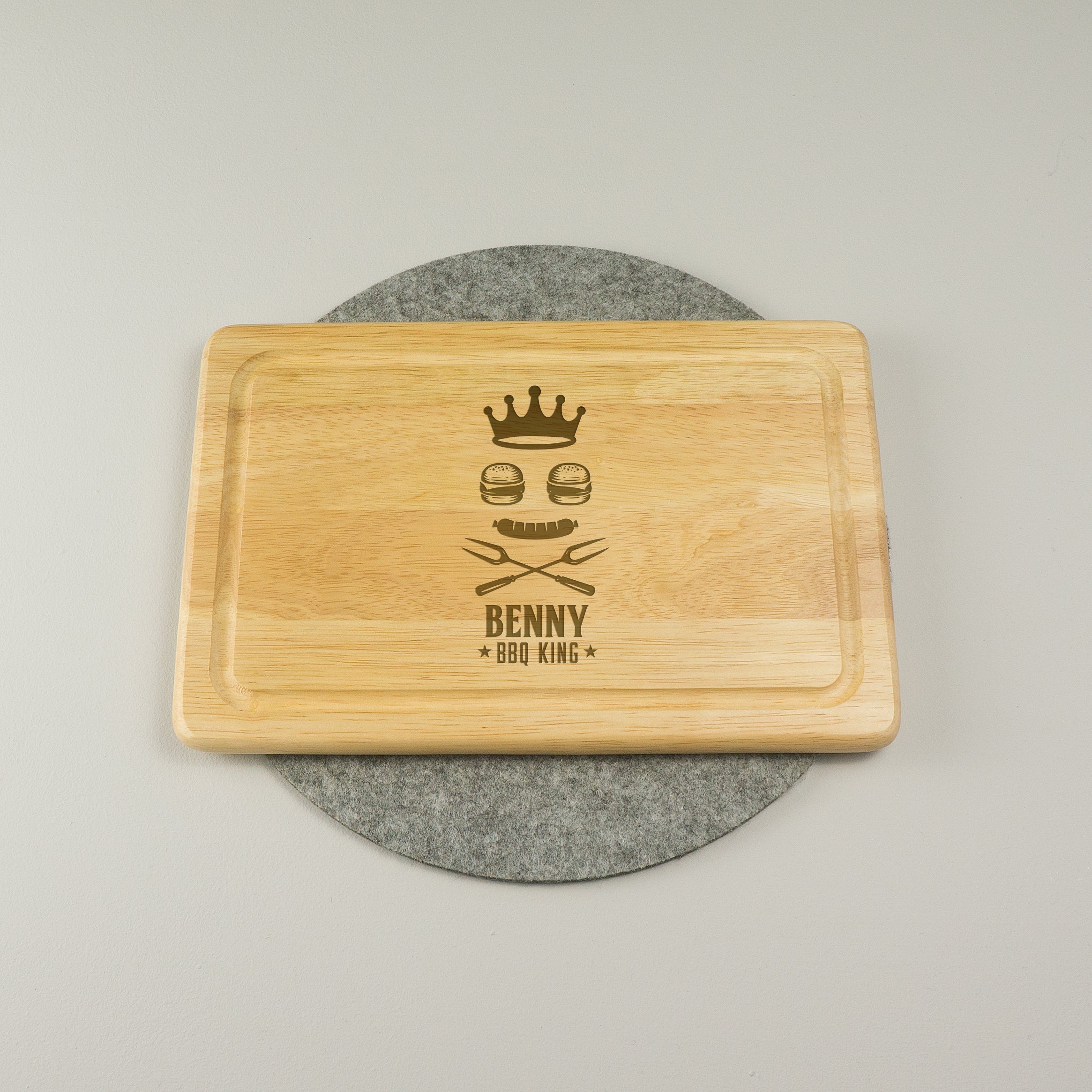 Personalised King of the BBQ wooden chopping board.