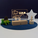 Personalised child's dinosaur LED name plaque. Light up bedroom sign