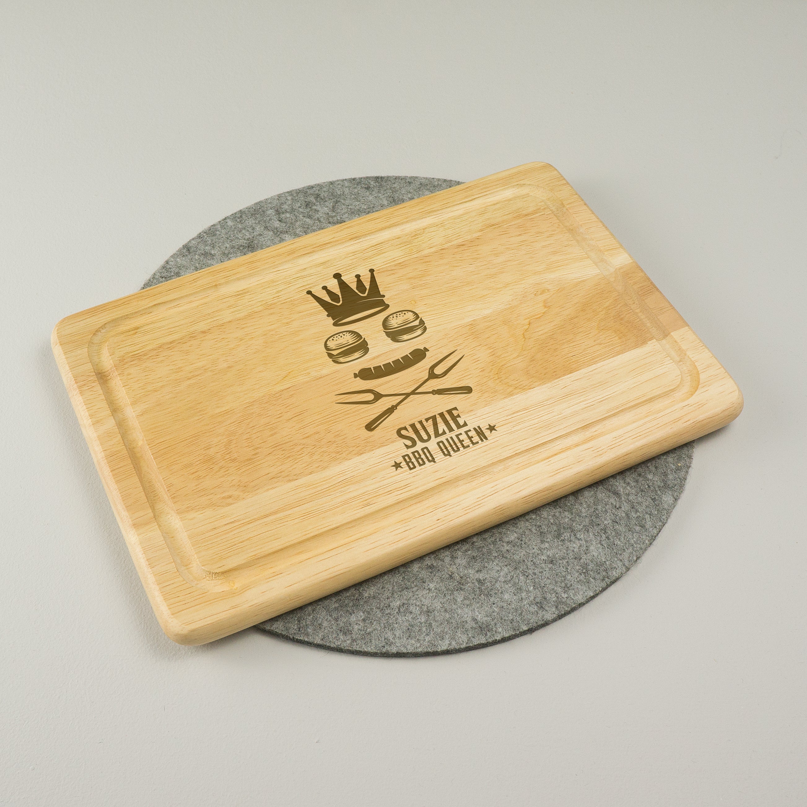 Personalised Queen of the BBQ wooden chopping board.
